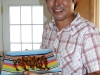 Eddie shows off the sake and soy marinated frog legs