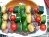 Baby octopus skewers, ready to grill
