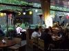 Daylight and paper lanterns light Chaya's outdoor beer garden