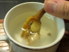 Rinsing the steamer in clam brot