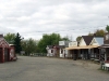 Historic buildings line both sides of the drive in Frontier Village