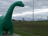 A leftover dinosaur terrorizes a former Sinclair gas station