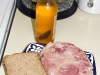 Head cheese sandwich and a chili beer