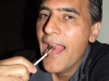 Eating a scorpion pop with my I Ate A Bug Club button on