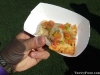 A pastel from Ta Bom topped with vinaigrette (Brazilian pico de gallo)