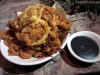 Rice-coated calamari with a squid ink aioli