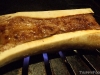 Beef marrow bone on the grill