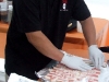 Shuji Sakai prepares the Bacon Explosion