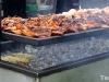 That corn is lying on the coals on purpose