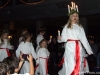 Emma Ejwertz as Santa Lucia leads the light processio