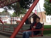 I throw the largest swing off-balance by sitting at one end
