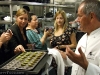 Wolfgang Puck offers green tea Madeleines to the food bloggers