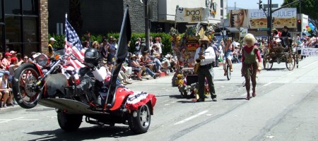 Senor Groucho performs a public sax act behind a trike