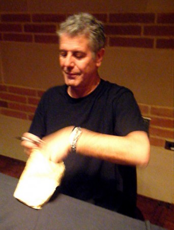 Anthony Bourdain checks out the bag of hormigas culonas