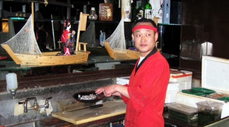 The chef at Beverly Living Fish Center prepares our live octopus