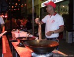 Chef Lupe Liang of Hop Woo drops pig intestines in hot oil