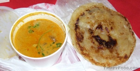 Roti prata with chicken curry