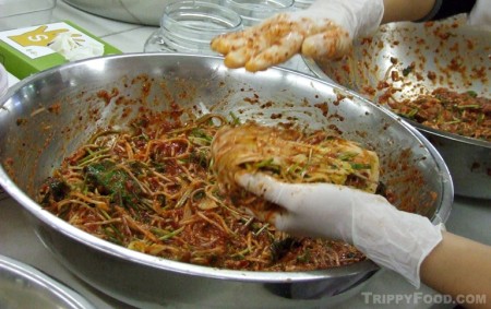 Folding over the cabbage loaded up with the kimchi mix
