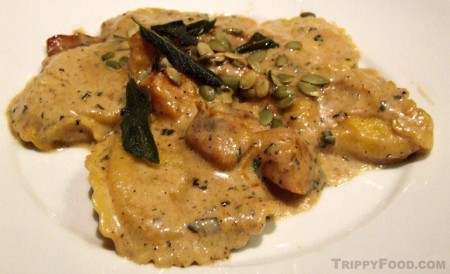 Pumpkin ravioli with chunks of pumpkin and seeds