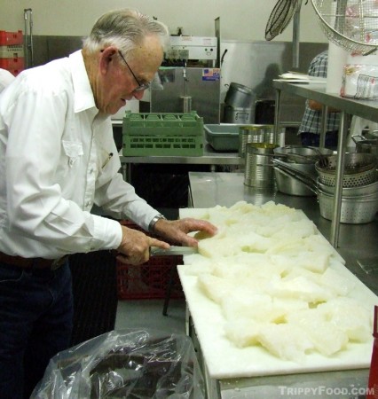 Bob Olsen prepares the lutefisk for cooking