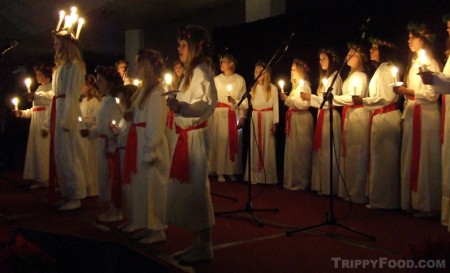Lucia leads the choir in holiday song