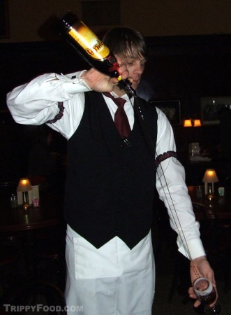 A bartender prepares a Spanish coffee