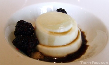 A tiny frozen Coke pearl shelters against panna cotta