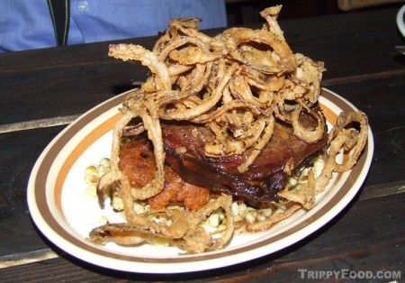 In that mound of food lies a boar meatloaf wrapped in bacon