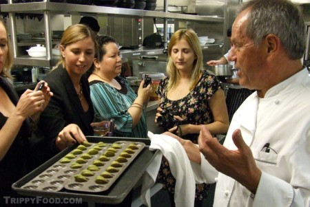 Wolfgang Puck offers green tea Madeleines to the food bloggers