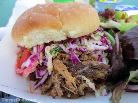 Kings Row's completed pulled pork sandwich topped with slaw