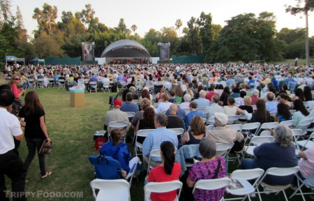 An eager audience awaits the arrival of the maestro