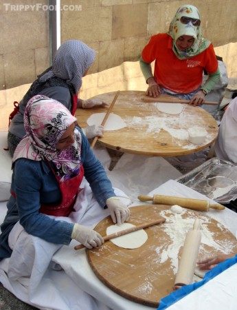 Women preparing the tortilla-like pastry by hand for gözleme