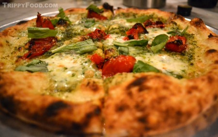 The Selvatica, a pie featuring basil pesto, roasted tomatoes and pine nuts