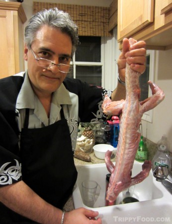 Rinsing the skinned, gutted iguana