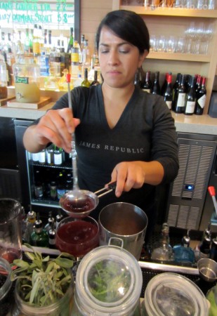 Bartender Pamela Trujillo using fresh ingredients for libations