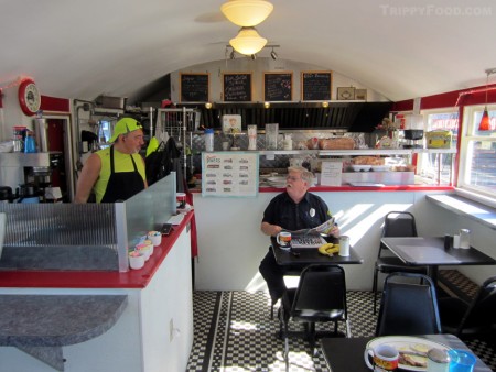 Owner and cook Nick Master checks in with one of his regulars