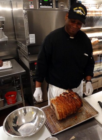 Sizing up rotisserie pork right off the spit